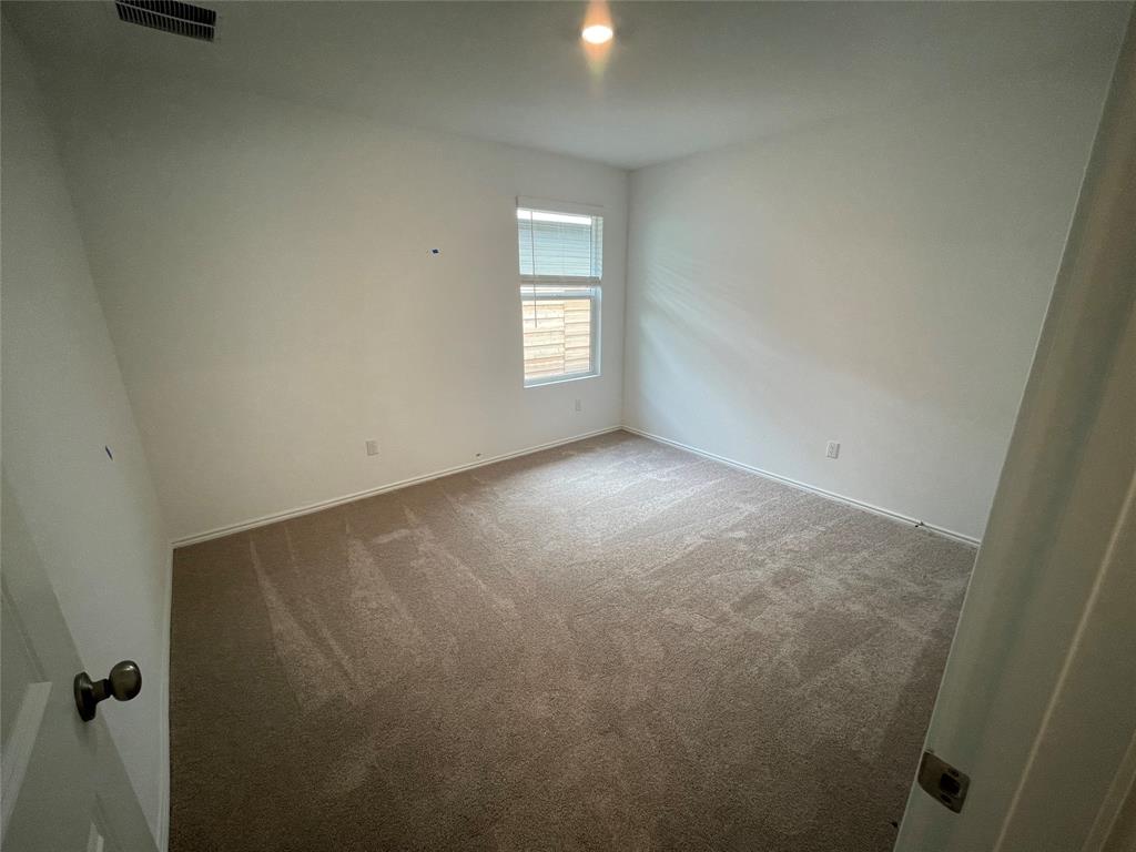 373 Jeffers Kyle, TX 78640 - Photo 16 of 26 Spare room featuring carpet flooring and baseboards