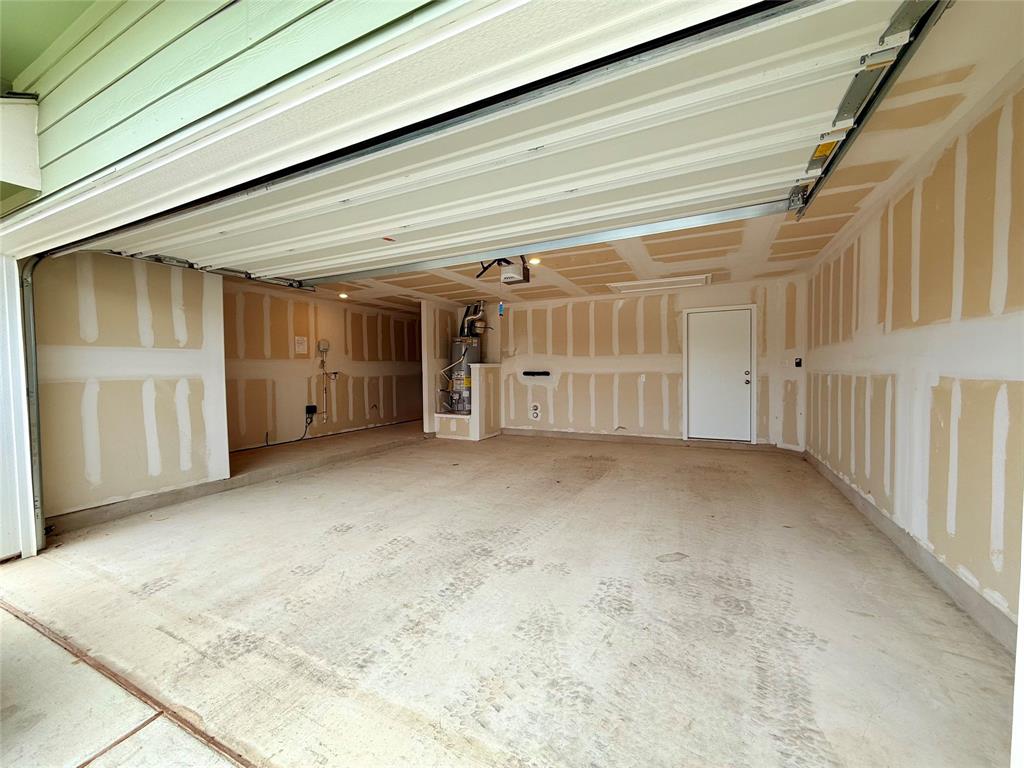373 Jeffers Kyle, TX 78640 - Photo 18 of 26 Garage featuring water heater