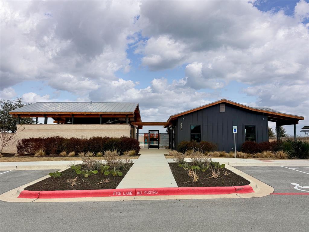 373 Jeffers Kyle, TX 78640 - Photo 21 of 26 View of property featuring uncovered parking