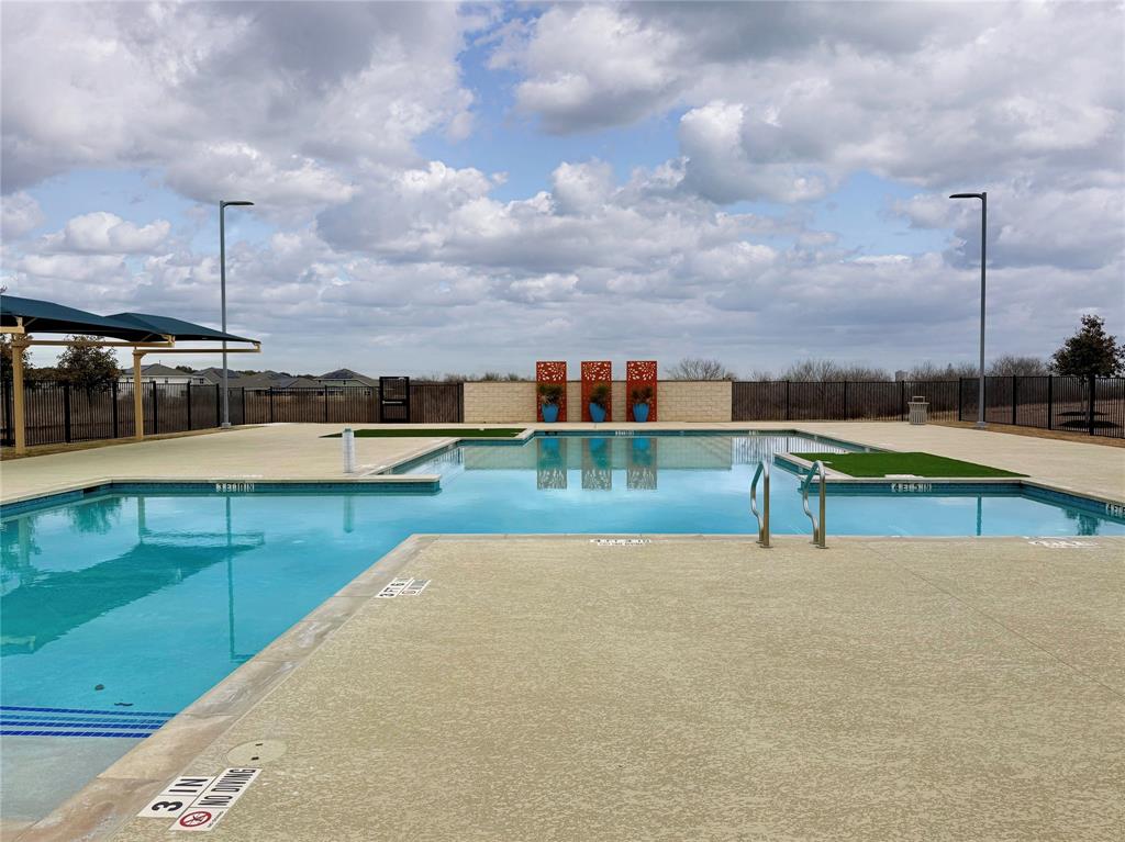 373 Jeffers Kyle, TX 78640 - Photo 23 of 26 Community pool with a patio area