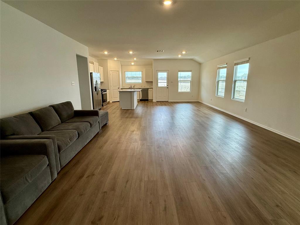373 Jeffers Kyle, TX 78640 - Photo 3 of 26 Living area featuring dark wood-style floors and recessed lighting