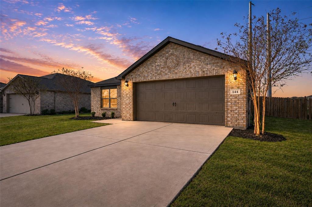 144 Barbwire Way Newark, TX 76071 - Photo 2 of 32 a front view of house with yard