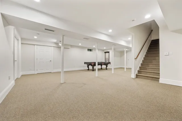 a view of an empty room with wooden roof