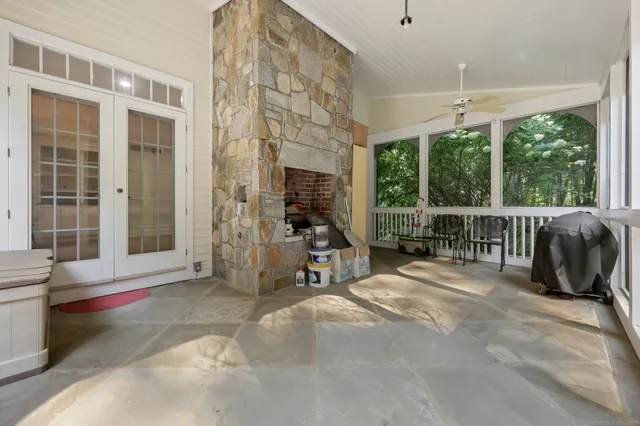 a view of an house with backyard and balcony