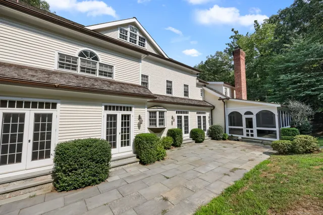 a view of a backyard with wooden fence