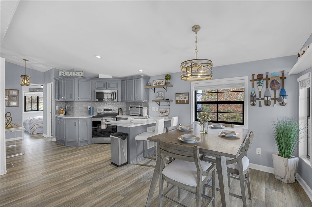 1230 Melton Road, Unit 15 West Union, SC 29696 - Photo 11 of 50 This inviting kitchen and dining area offers comfortable living and culinary convenience.