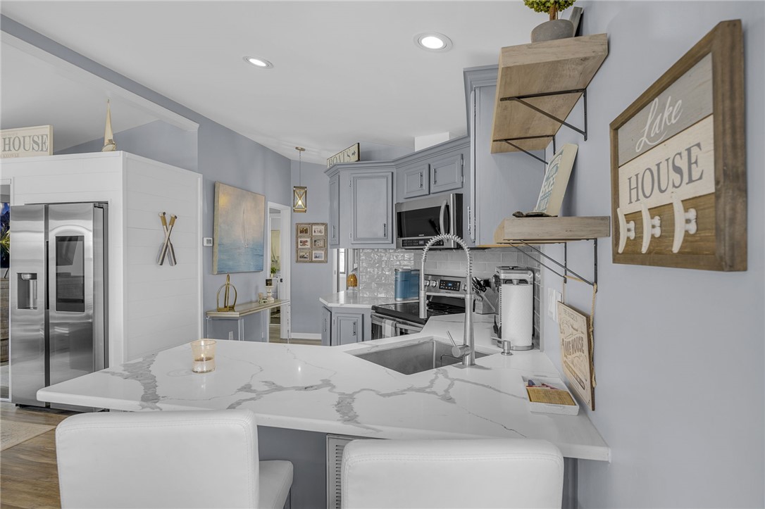 1230 Melton Road, Unit 15 West Union, SC 29696 - Photo 15 of 50 This modern kitchen features a spacious island, sleek countertops, and contemporary appliances for stylish entertaining.