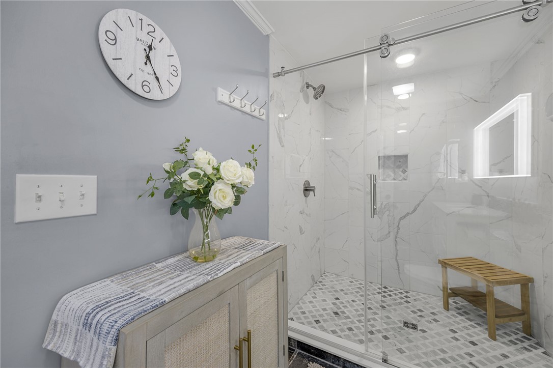 1230 Melton Road, Unit 15 West Union, SC 29696 - Photo 21 of 50 This primary bathroom features a shower with sleek glass doors and decorative tile.