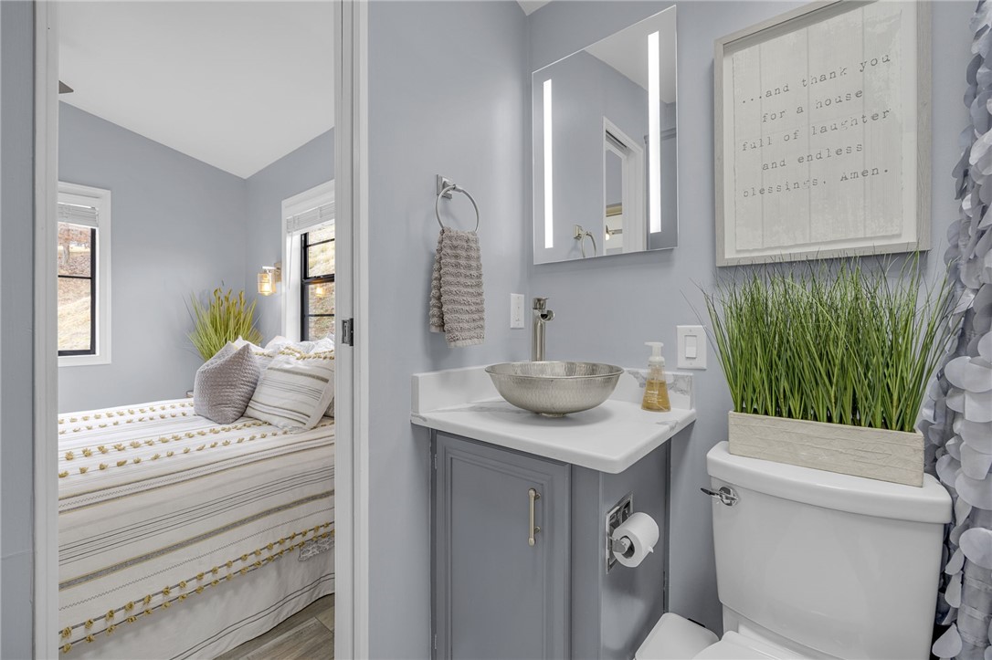 1230 Melton Road, Unit 15 West Union, SC 29696 - Photo 24 of 50 This serene bedroom with an attached bathroom offers a tranquil retreat.