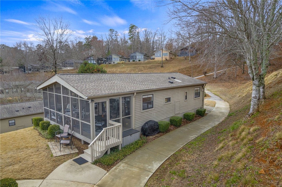 1230 Melton Road, Unit 15 West Union, SC 29696 - Photo 27 of 50 This charming home offers comfortable living with a private screened porch, perfect for enjoying the outdoors.