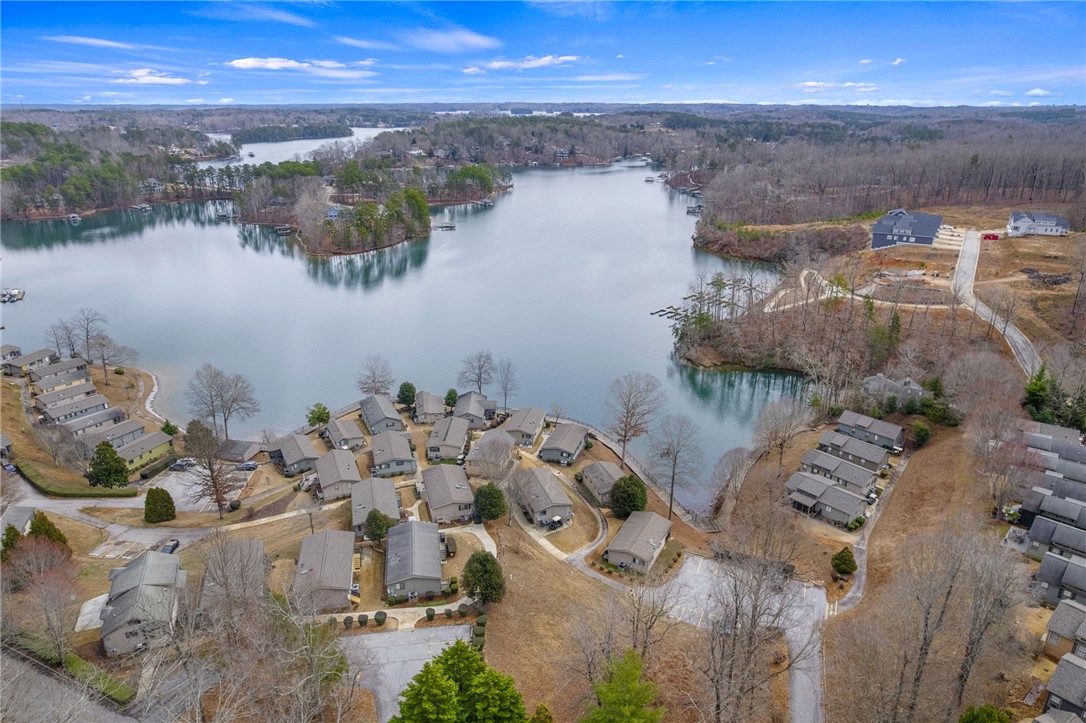 1230 Melton Road, Unit 15 West Union, SC 29696 - Photo 28 of 50 This aerial view showcases a vibrant community nestled along the tranquil waters of a expansive lake.