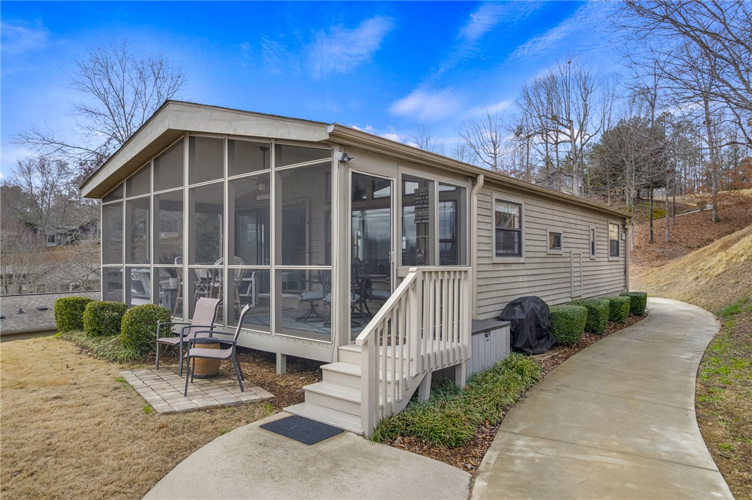 1230 Melton Road, Unit 15 West Union, SC 29696 - Photo 3 of 50 This charming home features a lovely screened porch and a convenient outdoor barbecue area.