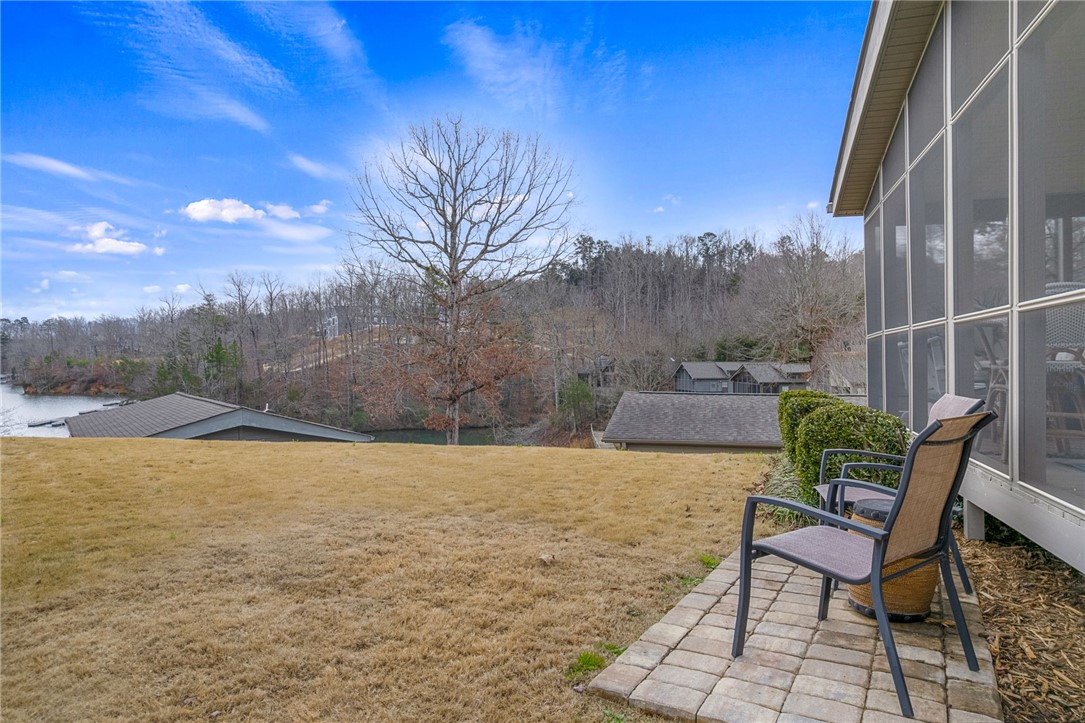 1230 Melton Road, Unit 15 West Union, SC 29696 - Photo 5 of 50 Enjoy tranquil water views from the patio and screened porch, offering serene outdoor living spaces.