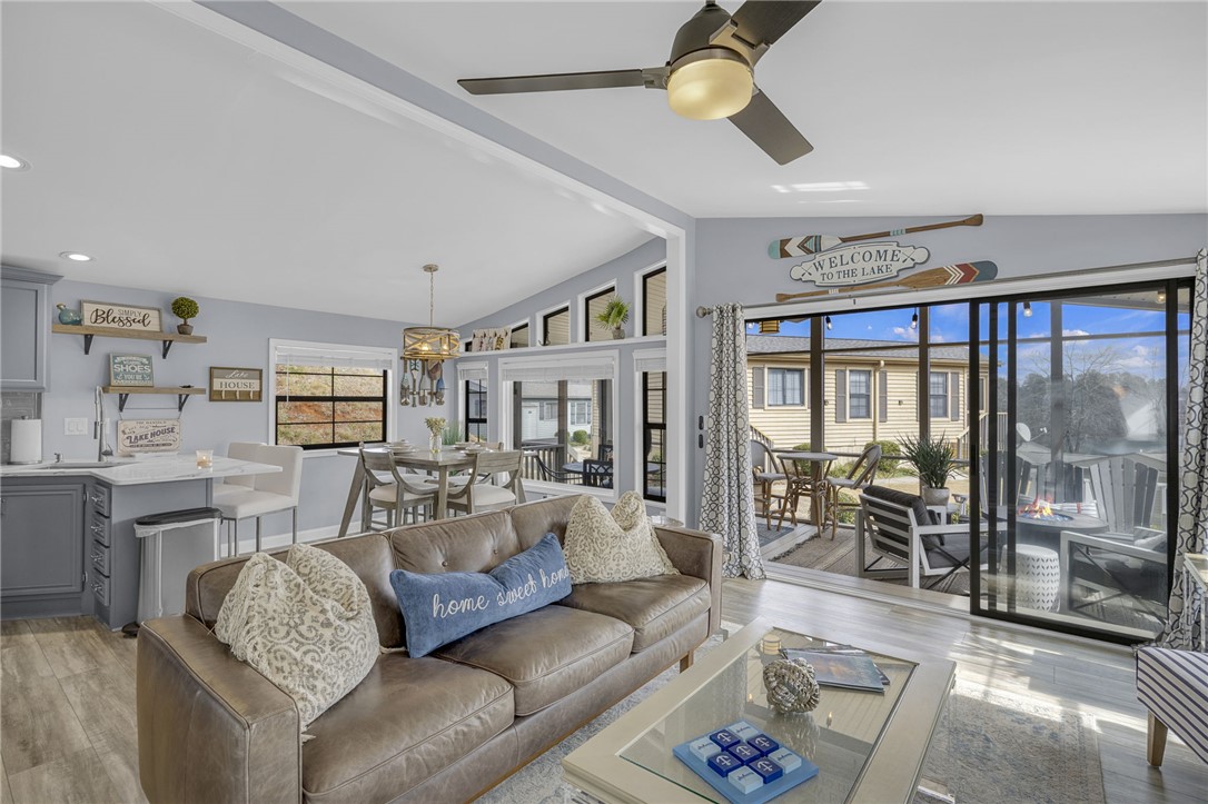 1230 Melton Road, Unit 15 West Union, SC 29696 - Photo 10 of 50 This airy living space with high ceilings and expansive windows offers comfortable, modern living.