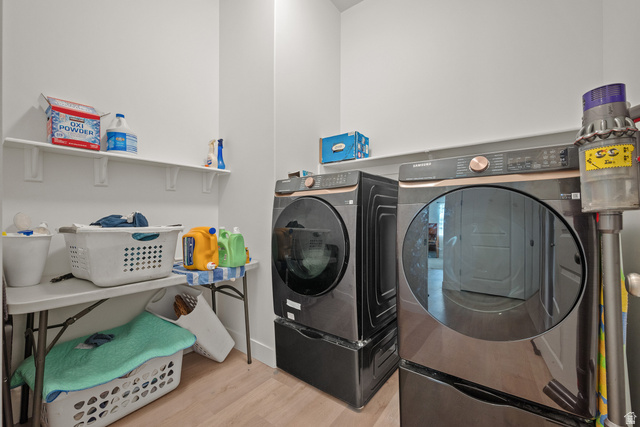 531 North Legend Way West, Unit D Mapleton, UT 84664 - Photo 25 of 42 Laundry room with light wood finished floors and separate washer and dryer