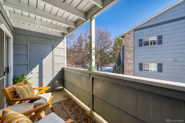 a view of balcony with furniture