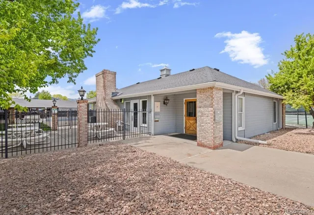 a view of a park with swings and slides