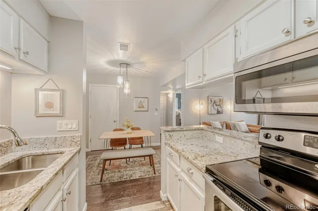 a kitchen with a stove and a sink