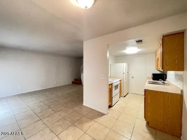 a view of a kitchen with a sink