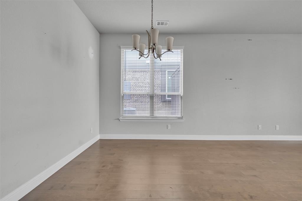 1802 Graham Way Mansfield, TX 76063 - Photo 11 of 38 a view of wooden floor and chandelier in living room