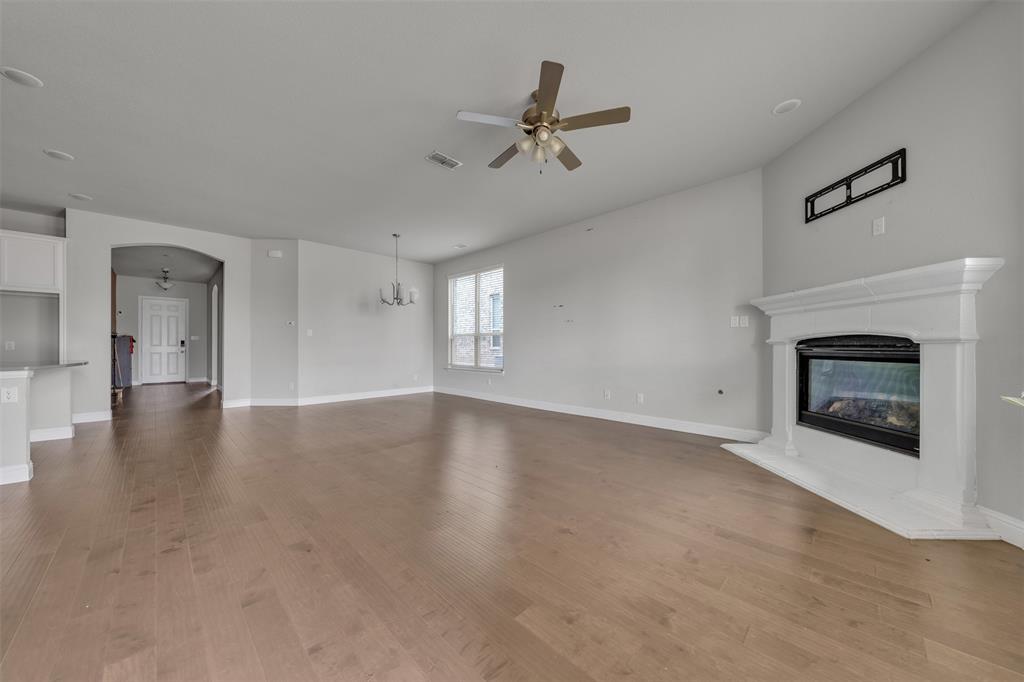 1802 Graham Way Mansfield, TX 76063 - Photo 15 of 38 a view of an empty room with a fireplace and a window