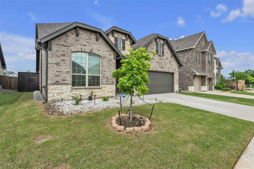 1802 Graham Way Mansfield, TX 76063 - Photo 2 of 38 a front view of a house with garden