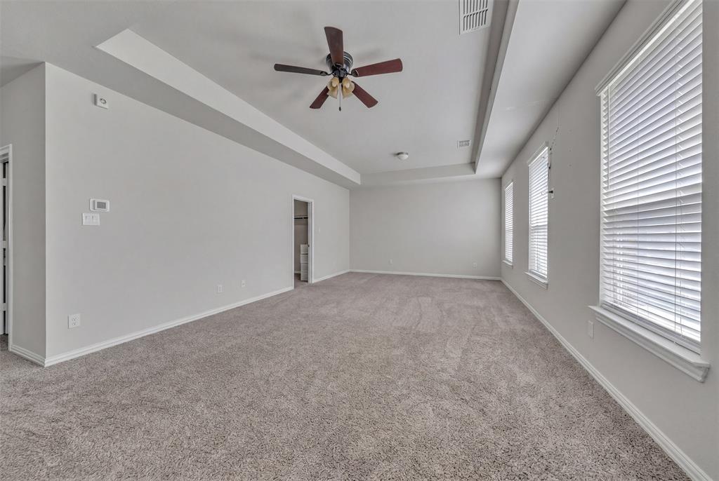1802 Graham Way Mansfield, TX 76063 - Photo 25 of 38 a view of a livingroom with a ceiling fan & window