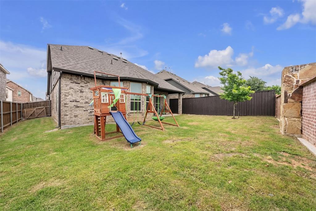 1802 Graham Way Mansfield, TX 76063 - Photo 37 of 38 a view of a house with a backyard