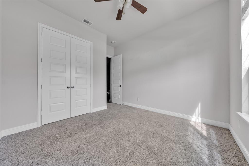 1802 Graham Way Mansfield, TX 76063 - Photo 6 of 38 an empty room with ceiling fan and window