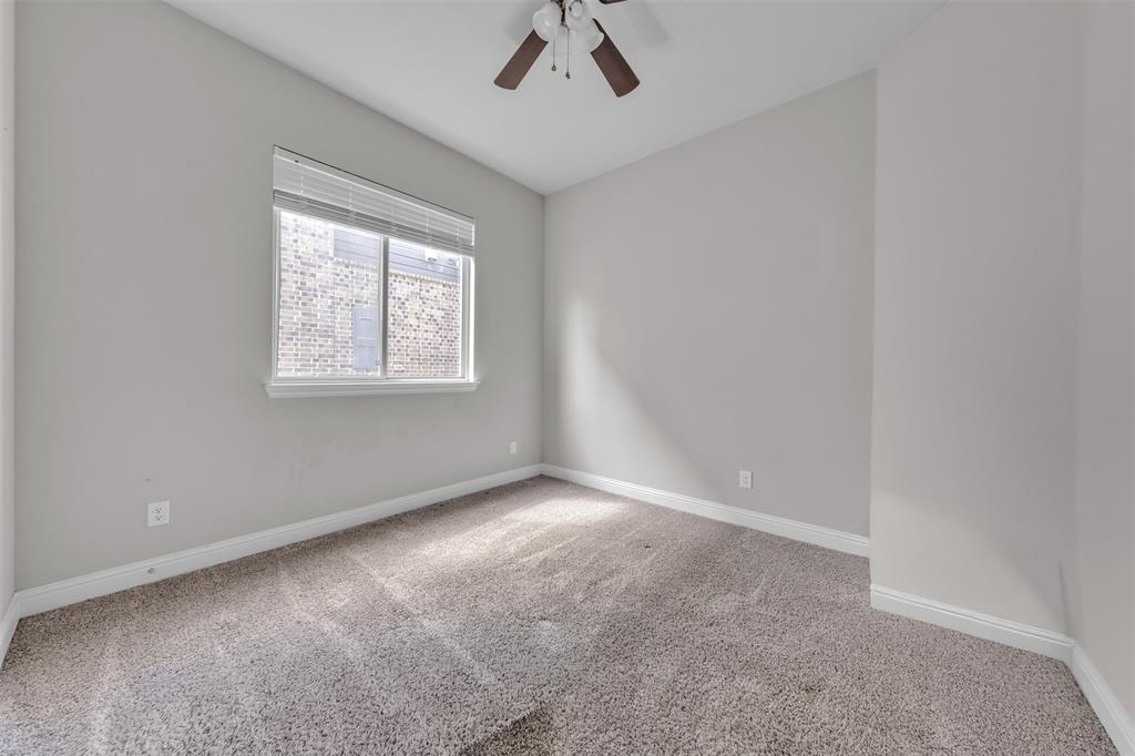 1802 Graham Way Mansfield, TX 76063 - Photo 8 of 38 an empty room with a chandelier fan and windows
