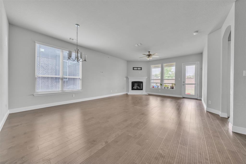 1802 Graham Way Mansfield, TX 76063 - Photo 10 of 38 a view of an empty room with window and wooden floor