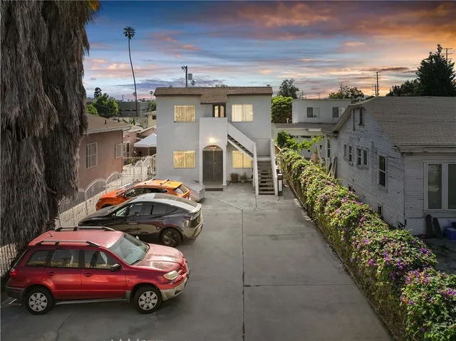 a front view of a house with parking space
