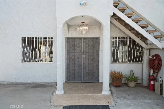 a view of an entryway with wooden floor