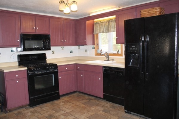 62 Edward Road Townsend, MA 01469 - Photo 3 of 14 a kitchen with a sink stove and refrigerator