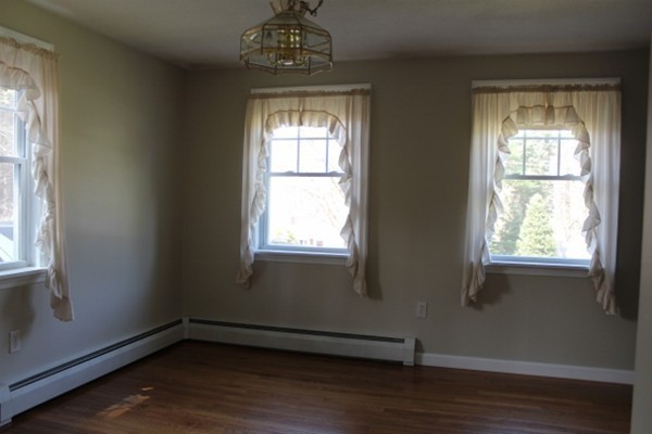 62 Edward Road Townsend, MA 01469 - Photo 6 of 14 a view of an empty room with wooden floor and a window