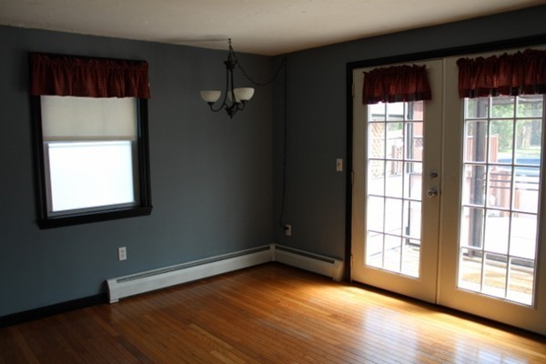 62 Edward Road Townsend, MA 01469 - Photo 7 of 14 an empty room with wooden floor and windows