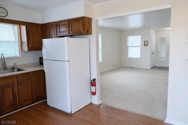 a view of kitchen with wooden floor