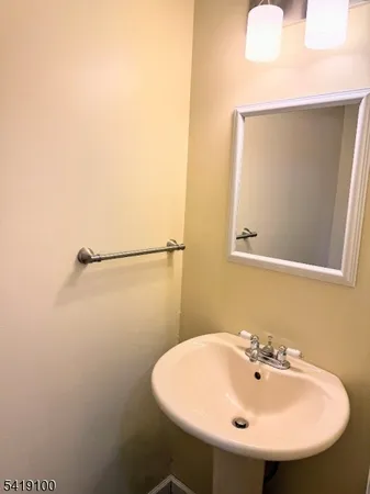 a bathroom with a sink and mirror