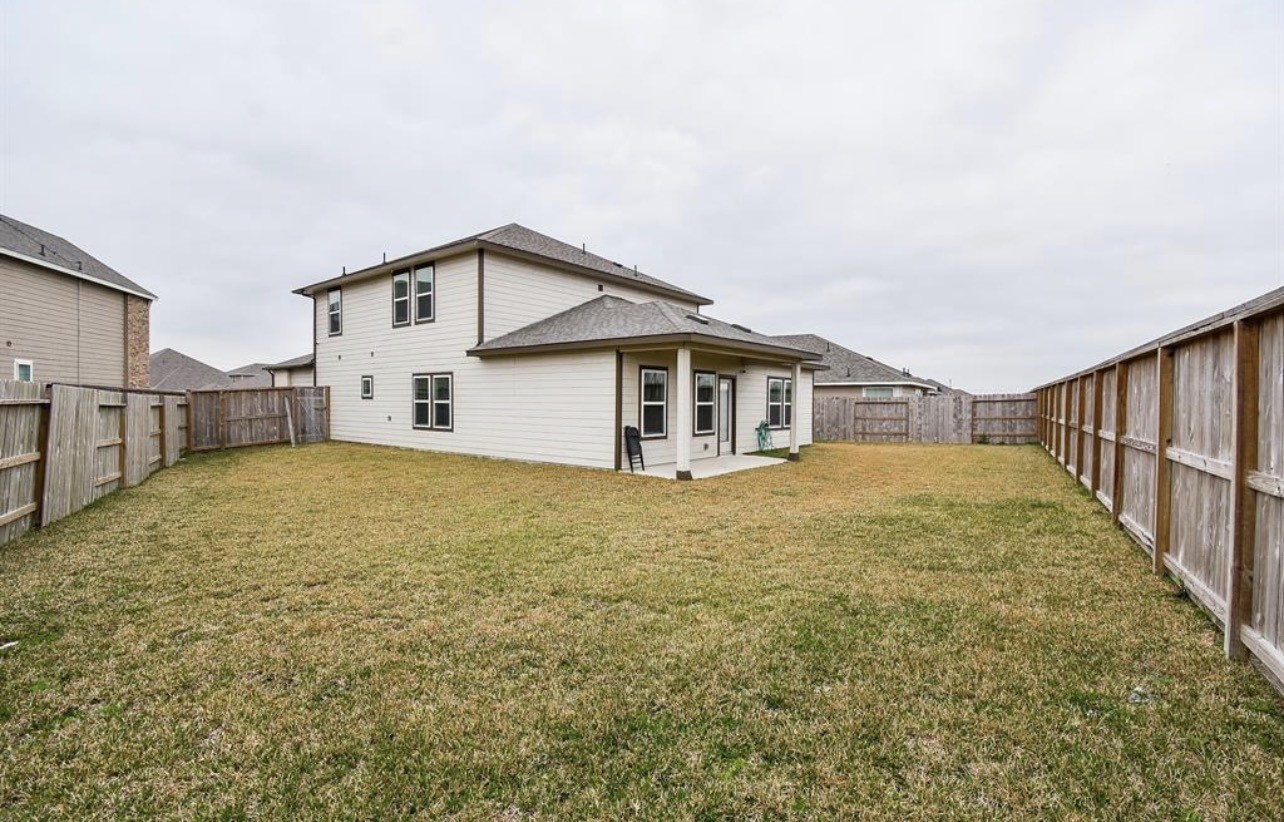 6927 Ventura Drive Rosharon, TX 77583 - Photo 20 of 20 Spacious backyard offering room for play, pets, or outdoor enjoyment. The open layout provides flexibility for everyday use and future personalization, making it a great space for families to enjoy.