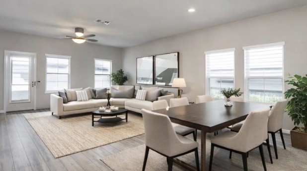 6927 Ventura Drive Rosharon, TX 77583 - Photo 3 of 20 Open living and dining combination designed in an open-concept layout, offering flexibility for everyday living and entertaining. Natural light fills the space, highlighting the neutral finishes and creating a comfortable setting for gatherings, family time, and shared meals. *virtually staged*