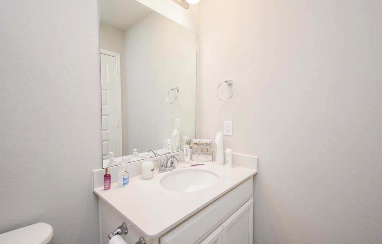 6927 Ventura Drive Rosharon, TX 77583 - Photo 6 of 20 Convenient half bath located on the main level, ideal for guests and everyday use. A practical feature that adds functionality without interrupting the flow of the home.