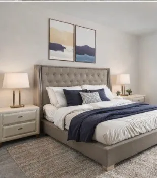 a bedroom with a bed and lamp