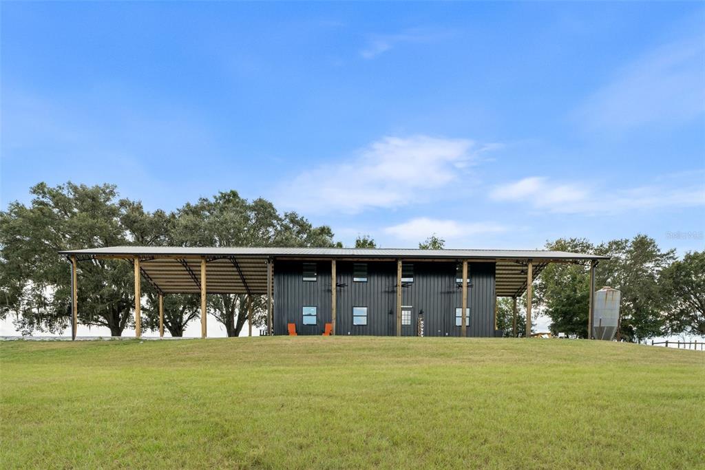 a front view of house with a garden and balcony