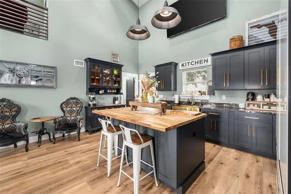 a kitchen with a table chairs and a stove