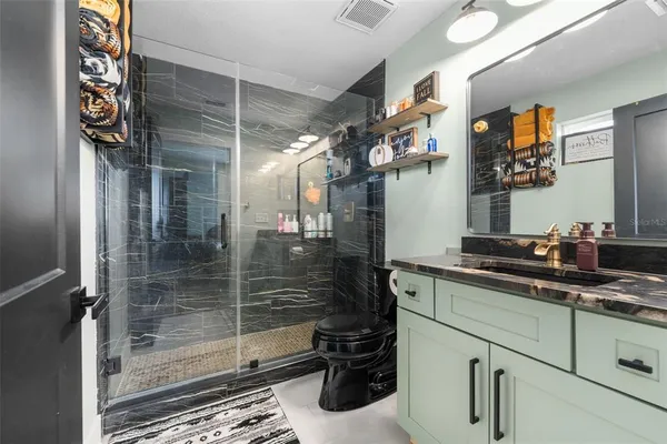 a kitchen with a sink and cabinets