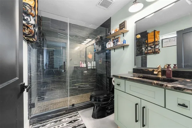 a kitchen with a sink and cabinets