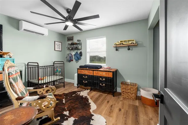 a bedroom with furniture and a window