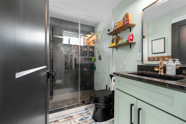 a kitchen with a sink and a refrigerator
