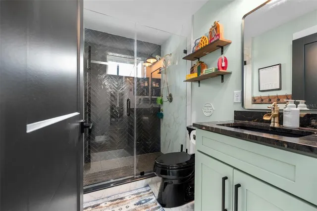 a kitchen with a sink and a refrigerator