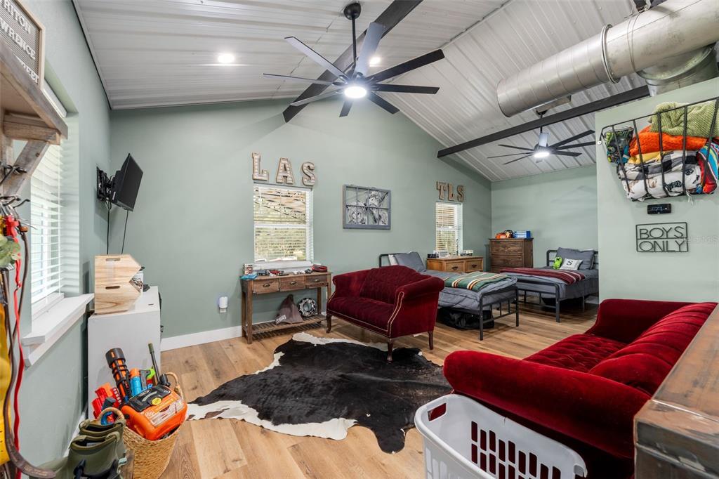 23220 Northwest 27 Street Morriston, FL 32668 - Photo 26 of 44 a living room with furniture a couch and a ceiling fan